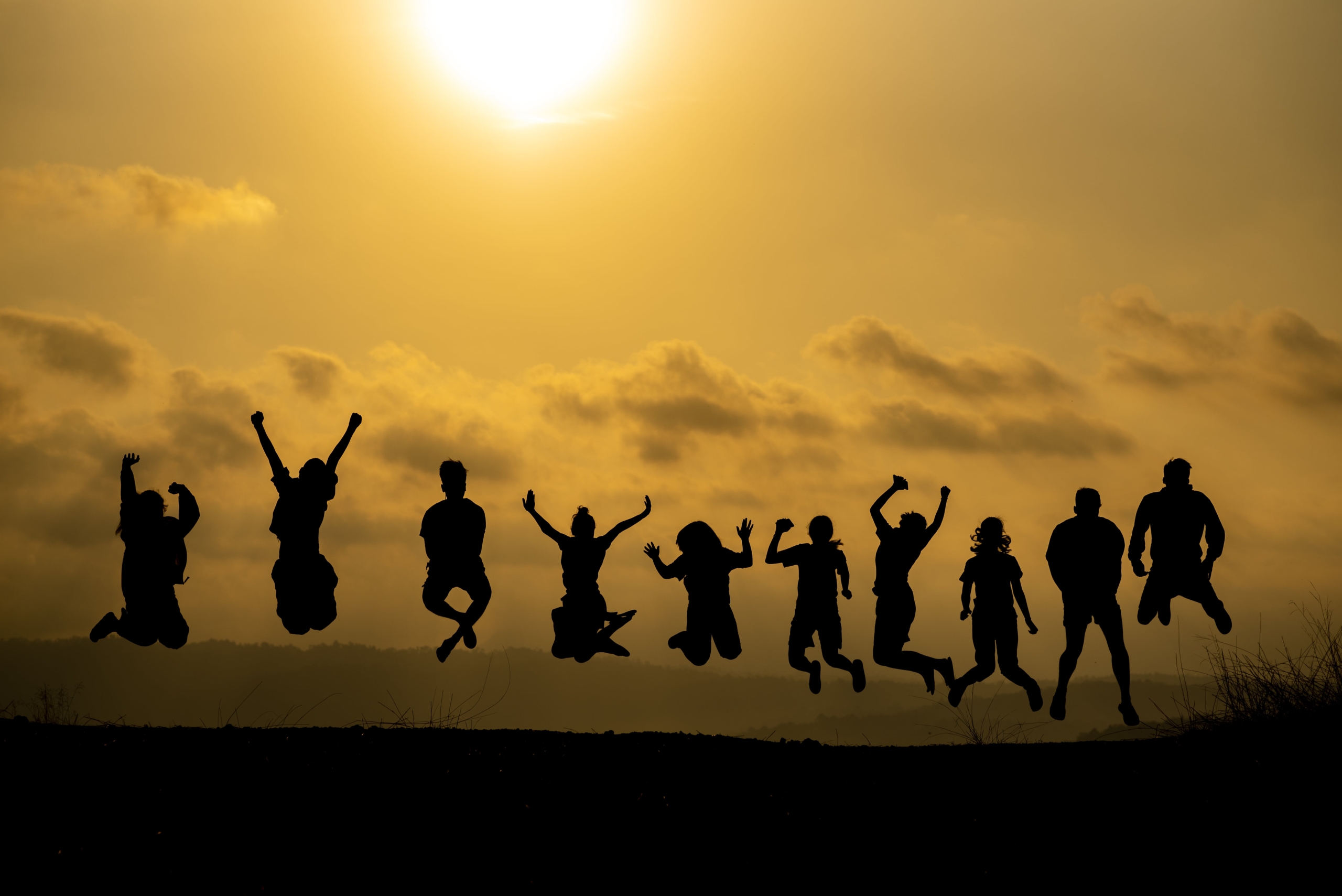 the-silhouette-of-a-group-of-people-is-celebrating-2021-09-01-01-45-44-utc-min